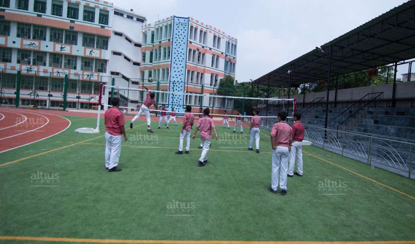 playing in school vollyball court