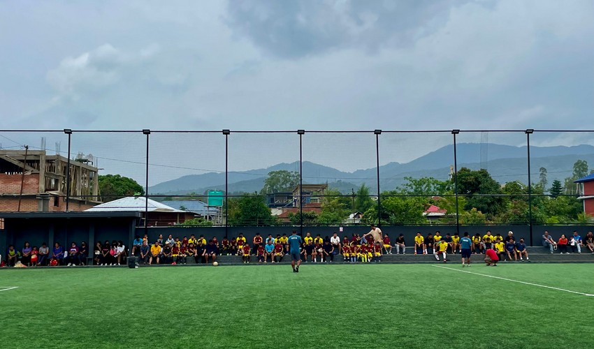 Footballers playing on a stadium