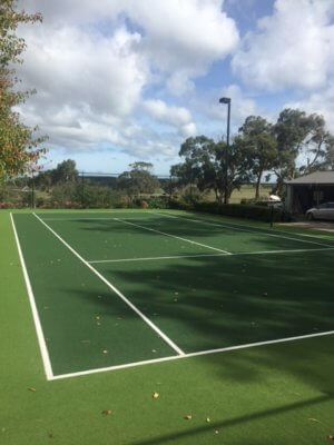 large tennis court in a lawn