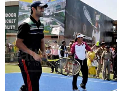 children playing tennis in school