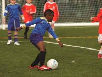 Young-kids-playing-football